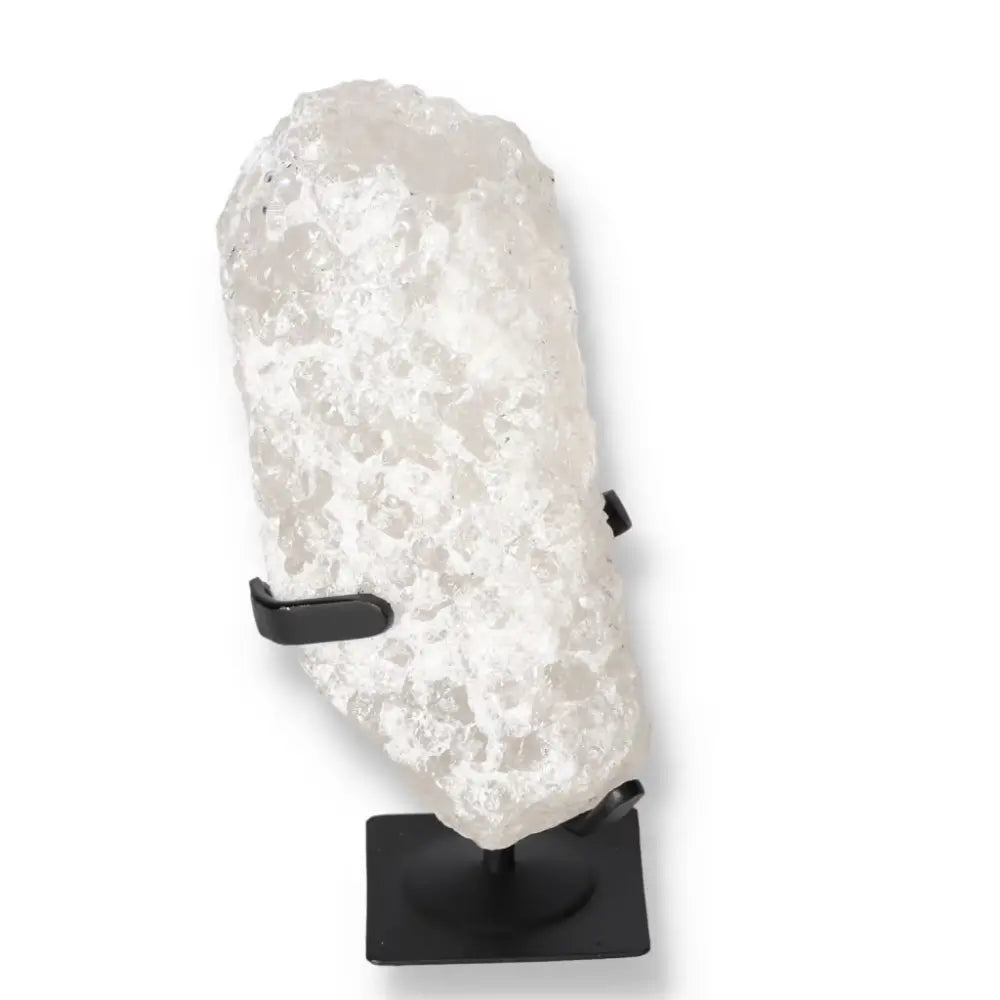 Quartz Crystal Bubble by Sylvia Crystals on display stand, showcasing luxurious clarity and spiritual energy for enhanced well-being.