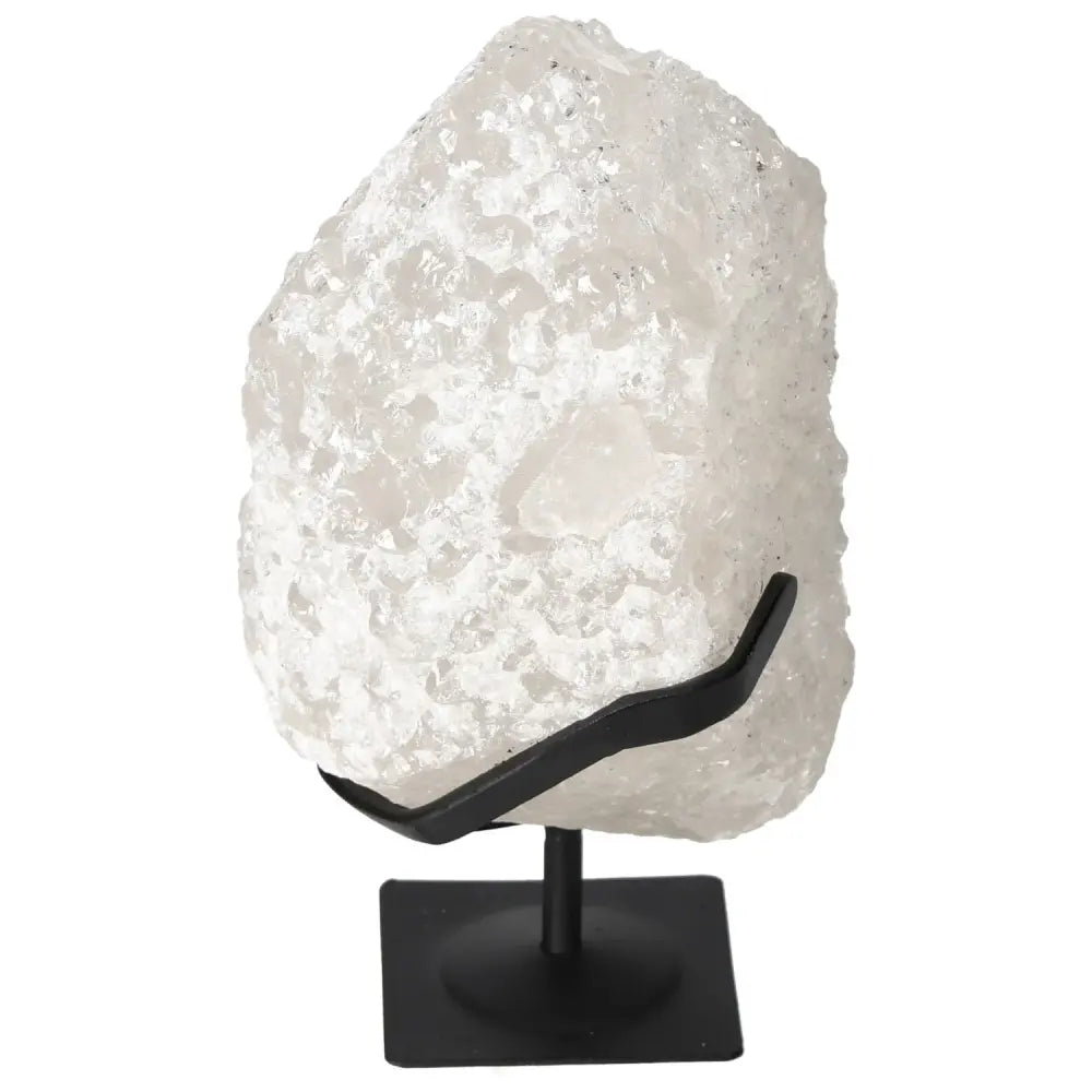 Quartz Crystal Bubble by Sylvia Crystals, a luxury decorative piece known for clarity and spiritual resonance, on a sleek black stand.