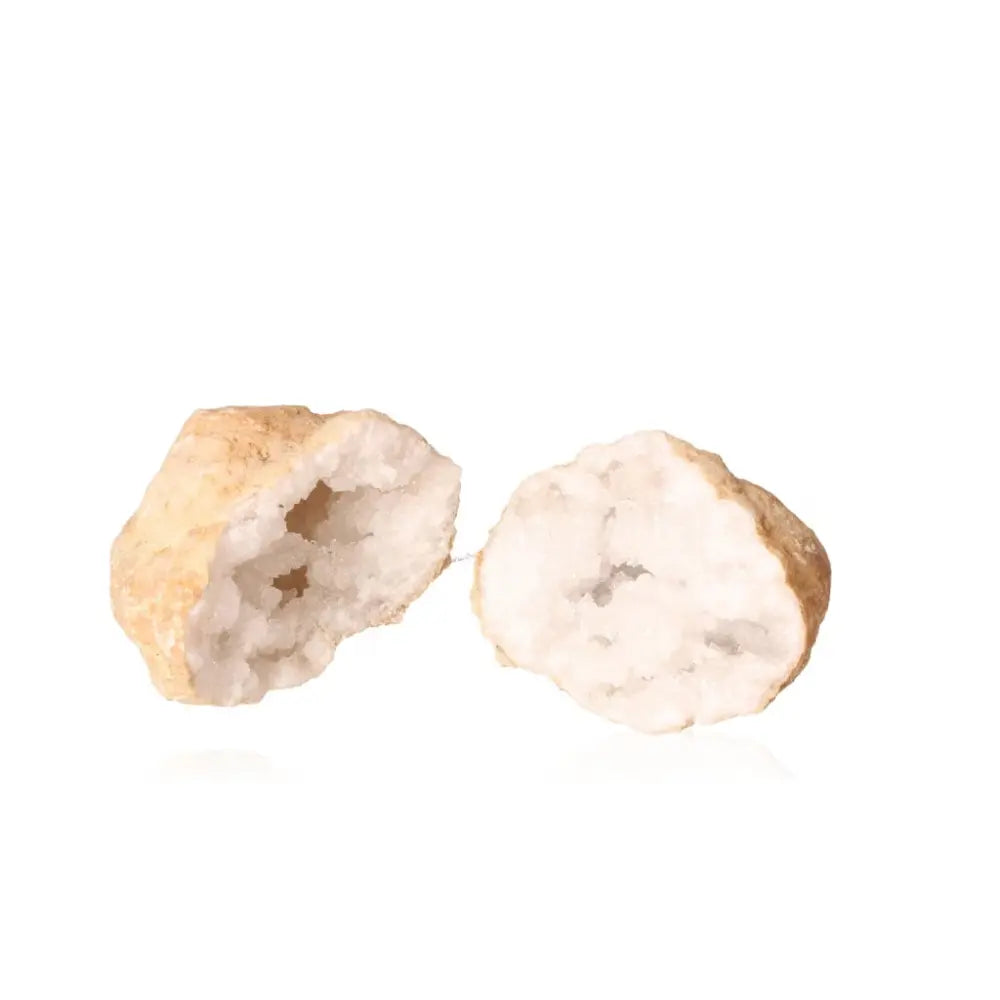 Cut open quartz geode revealing interior of cloudy white crystals against a white background, weighing between 1200-2000g.