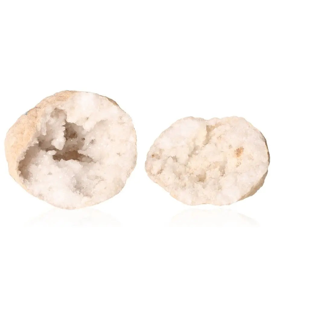 Split open quartz geode revealing cloudy white crystals, showcasing natural beauty and elegance.