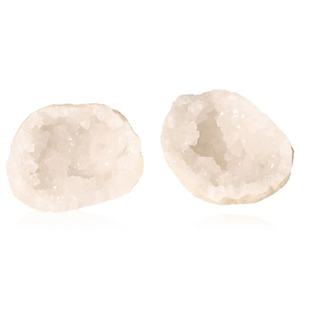 Open milky quartz geodes showcasing sparkling cloudy white crystals, perfect for adding mystical allure to any space.