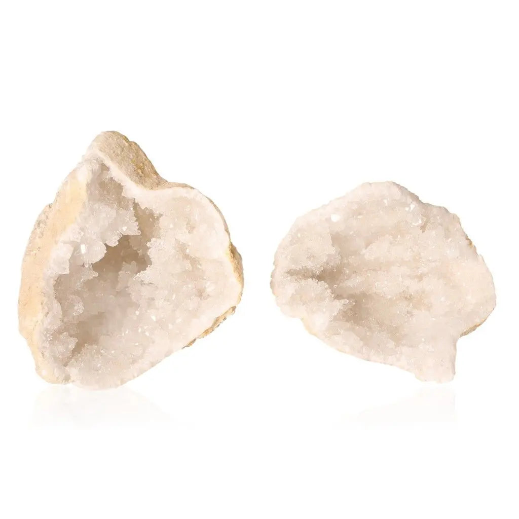 Quartz geode displaying sparkling cloudy white crystals, rugged shell.