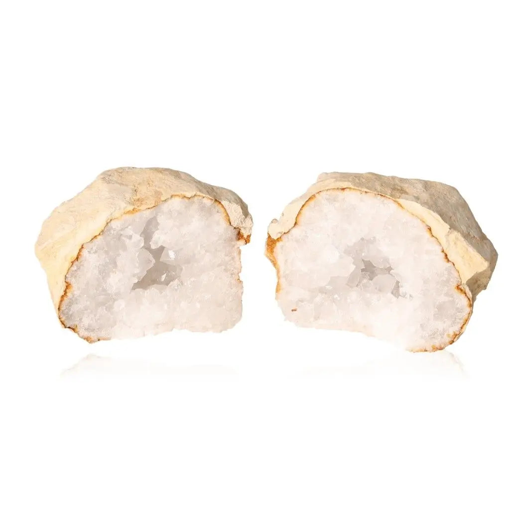 Split open quartz geode revealing sparkling white crystals, showcasing natural beauty and energy amplification characteristics.