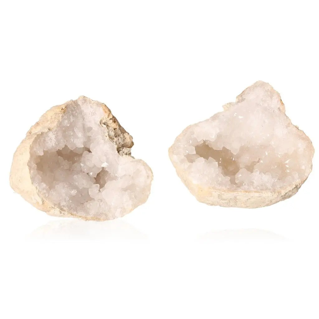 Quartz geode halves showcasing milky quartz crystals, highlighting natural beauty and elegance.