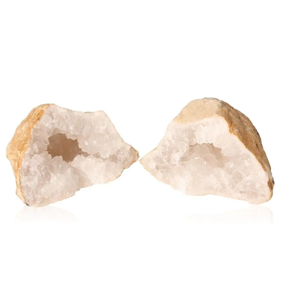 Open Quartz Geode displaying milky white crystals inside, highlighting natural beauty and metaphysical allure.