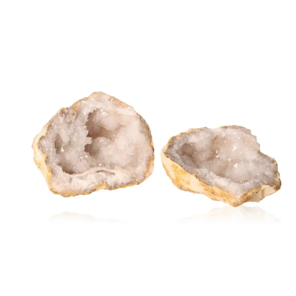 Milky quartz geode with cloudy white crystals, weighing 700-900g, showcasing rugged beauty and sparkling allure.