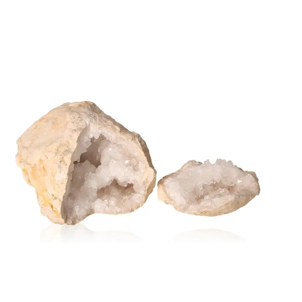 Quartz geode showcasing rugged exterior and sparkling white crystals, weighing 700-900g, known for energy purification and amplification.