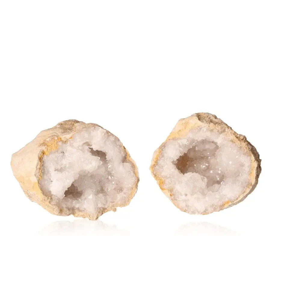 Open quartz geode displaying sparkling white crystals inside rugged earthy shell, weighing 700-900g.