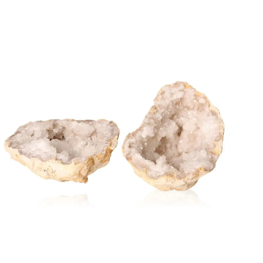 Open milky quartz geode displaying cloudy white crystals and rugged exterior, ideal for energy purification and amplification.