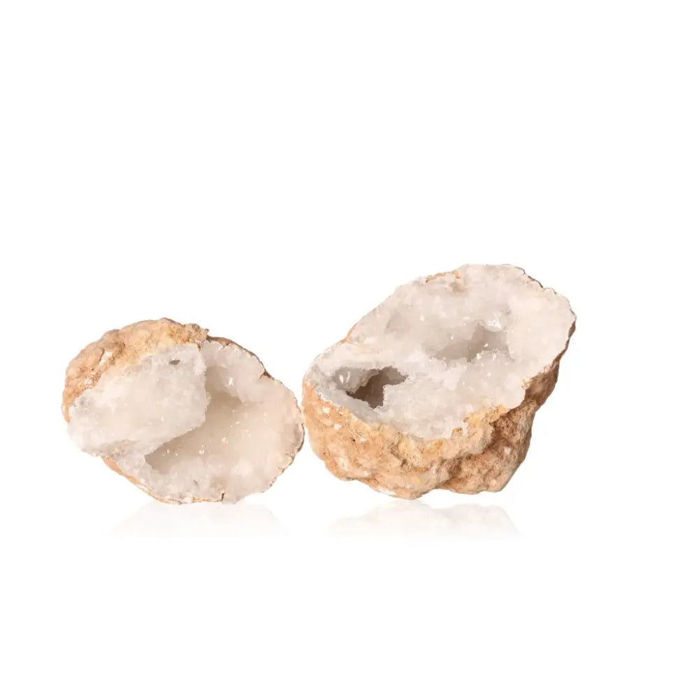 Quartz geode split open showing sparkling milky white crystals, weighing 700-900g. Perfect for adding peace and clarity to any space.