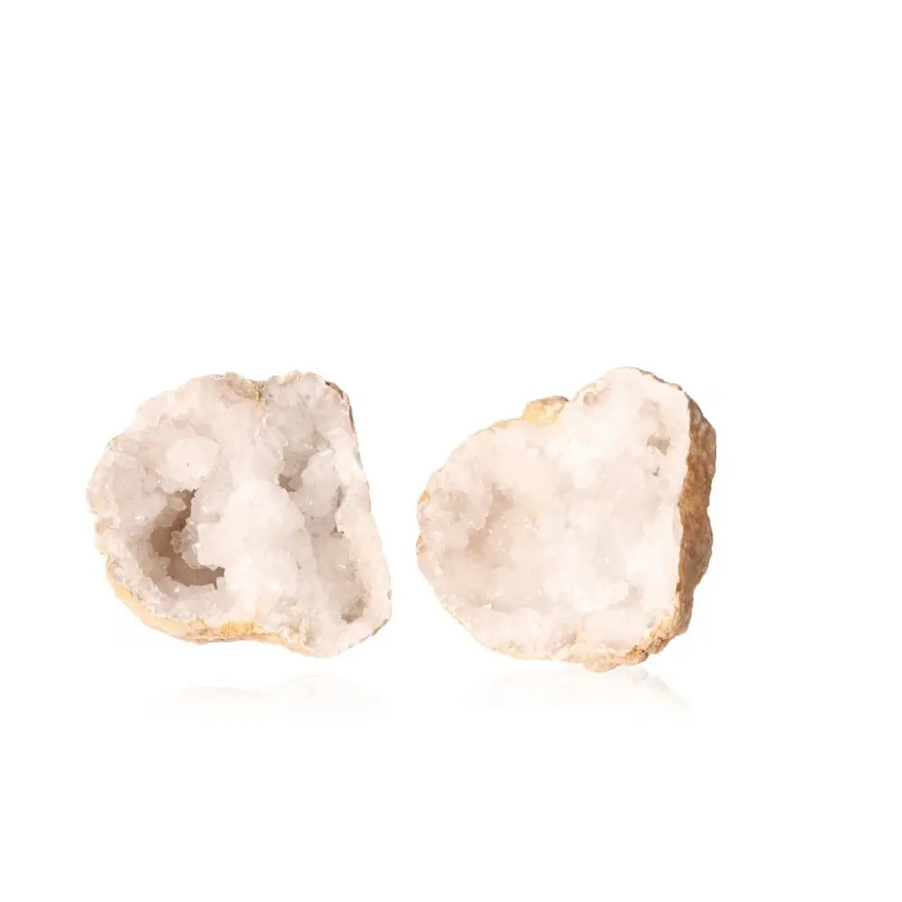 Quartz Geode showcasing its rugged exterior and sparkling, milky white crystal interior, perfect for energy amplification and purification.