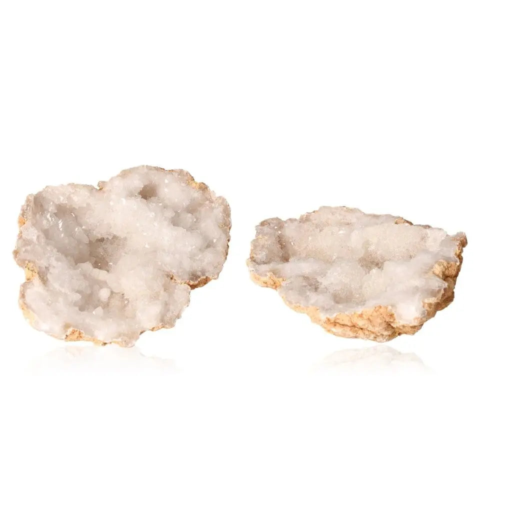 Open quartz geode showcasing sparkling white crystals with a natural earthy outer shell, weighing between 700-900g.