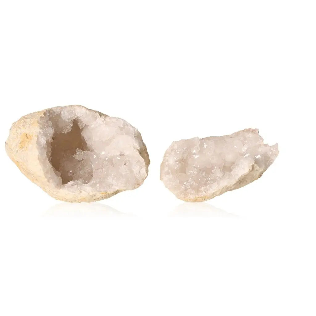 Quartz geode split open to reveal cloudy white crystals, showcasing its rugged outer shell and sparkling interior.