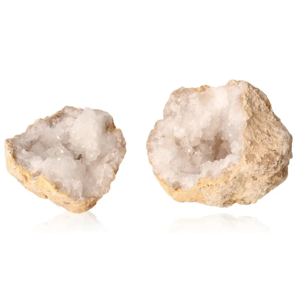 Open quartz geode revealing shimmering milky quartz crystals with a rugged exterior, ideal for decor or spiritual purification.