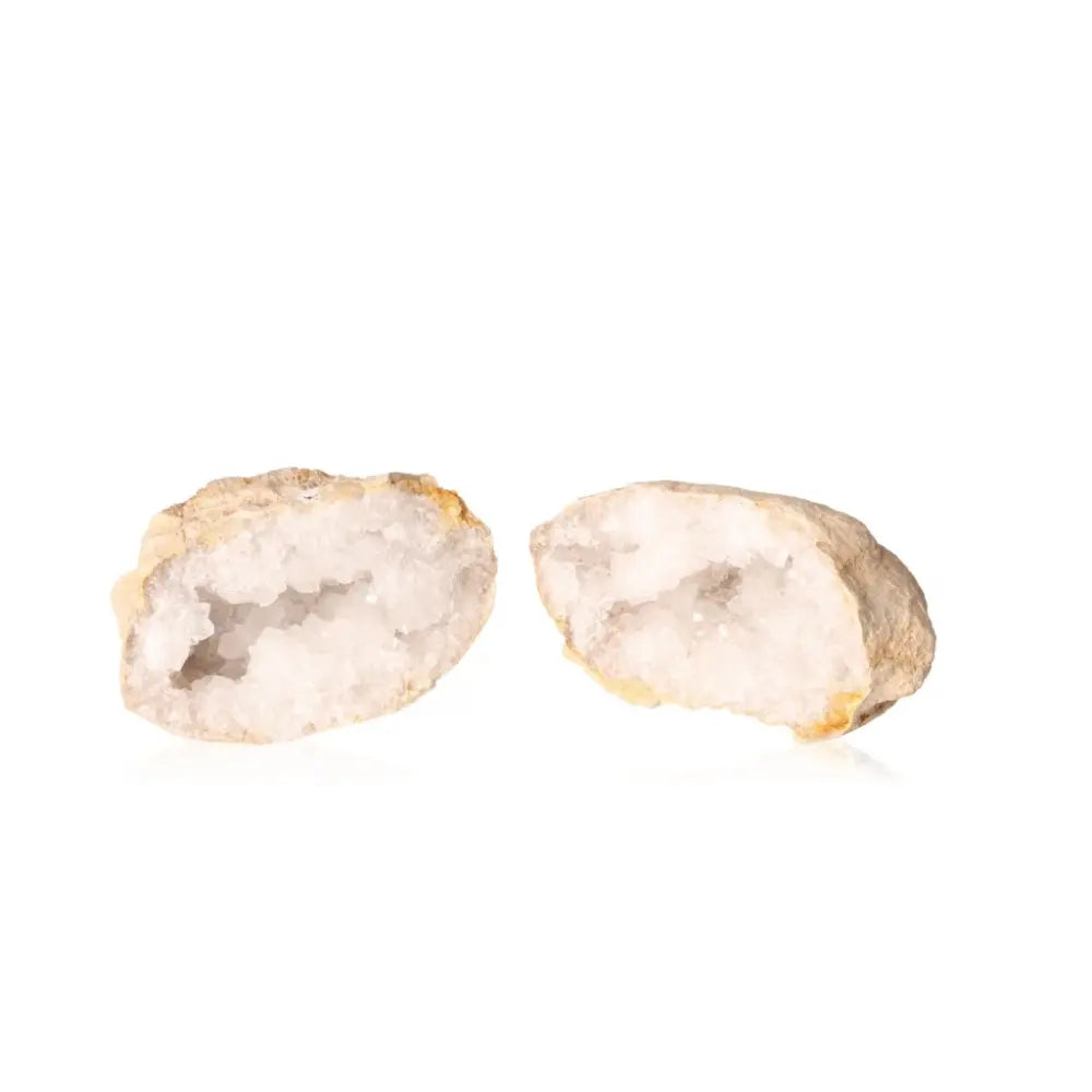 Open Quartz Geode showcasing sparkling white crystals inside its earthy shell.