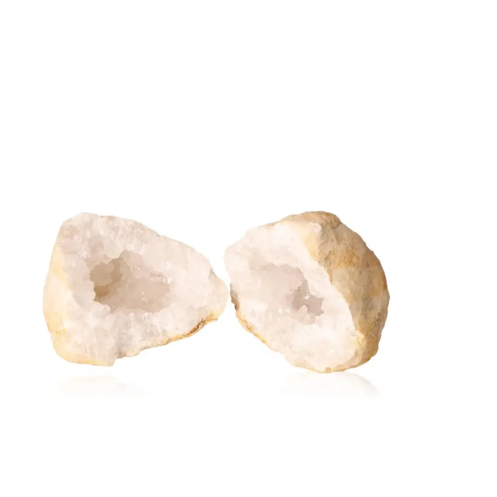 Quartz Geode 900-1200g with rugged outer and milky quartz crystals, symbolizing purity and natural beauty on a white background.