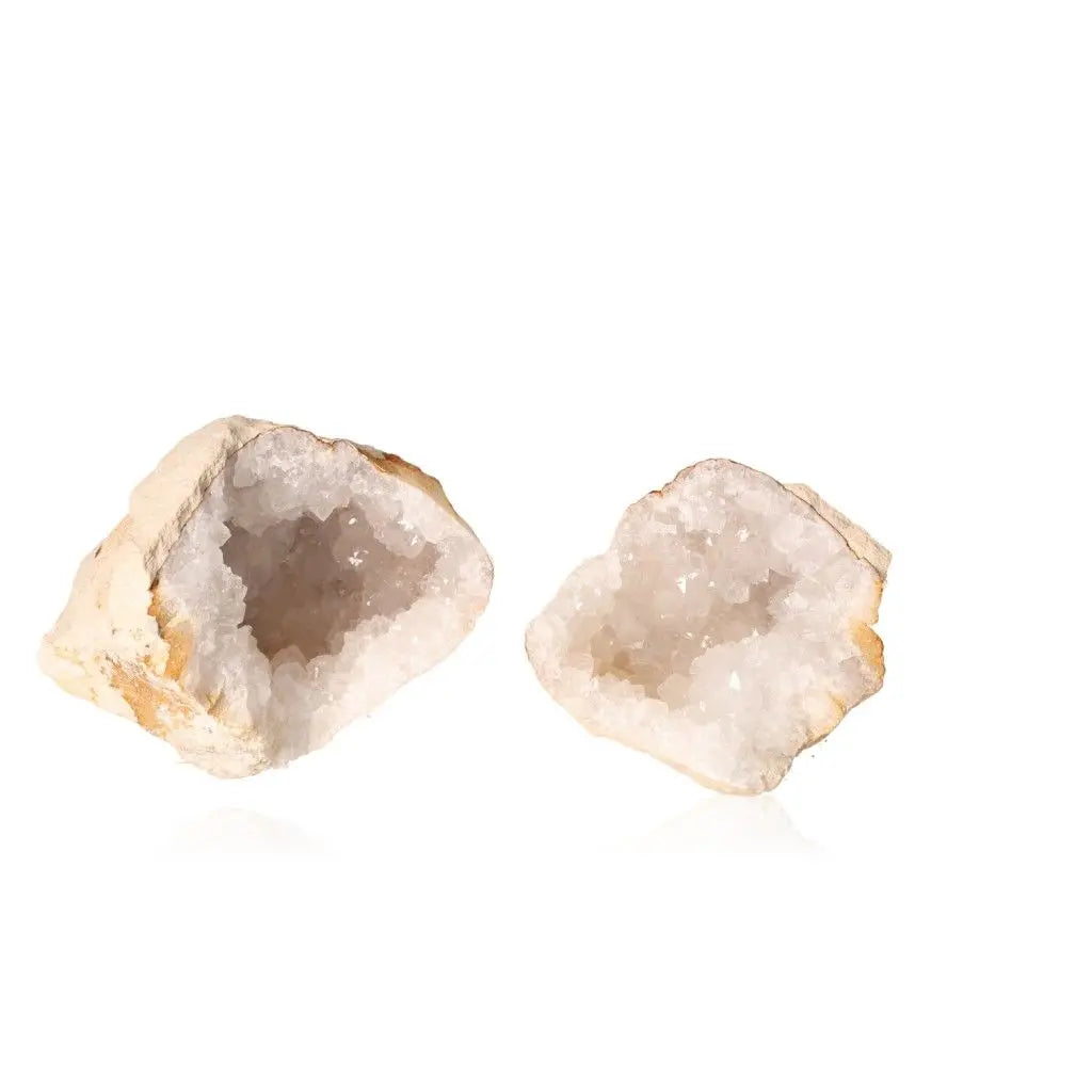 Quartz Geode (900-1200g) displaying a rugged exterior and sparkling white interior, ideal for energy purification and amplification.