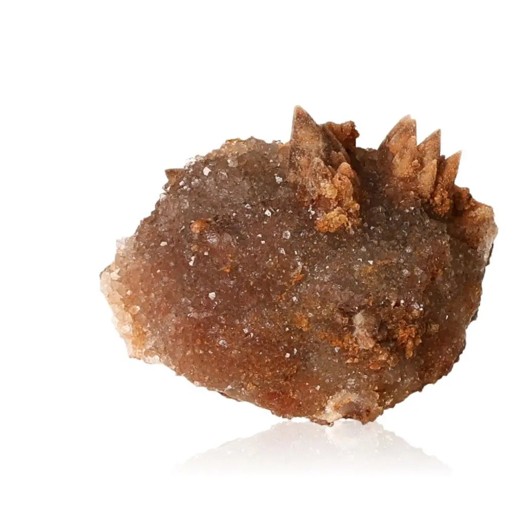 Quartz Stalactite with intricate, layered structure in subtle earth tones, symbolizing growth and luxury, from Sylvia Crystals.