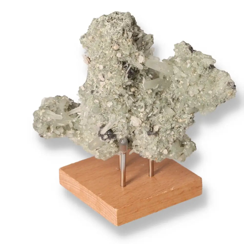 Raw quartz crystal on a wooden stand, showcasing its natural beauty and unique texture, ideal for spiritual and aesthetic enhancement.