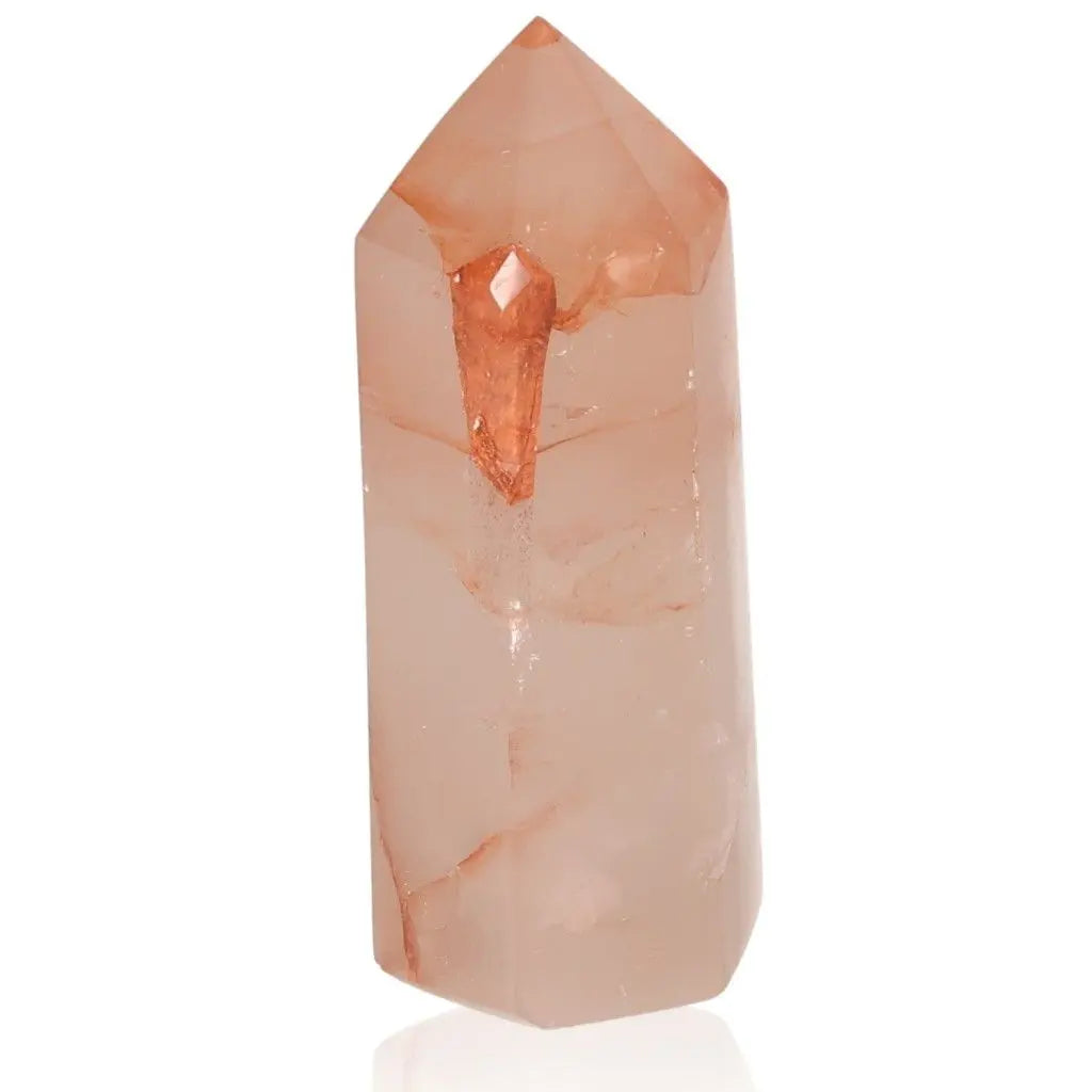 Red calcite tower stone linked to chakras and zodiac signs, enhancing energetic and spiritual well-being.