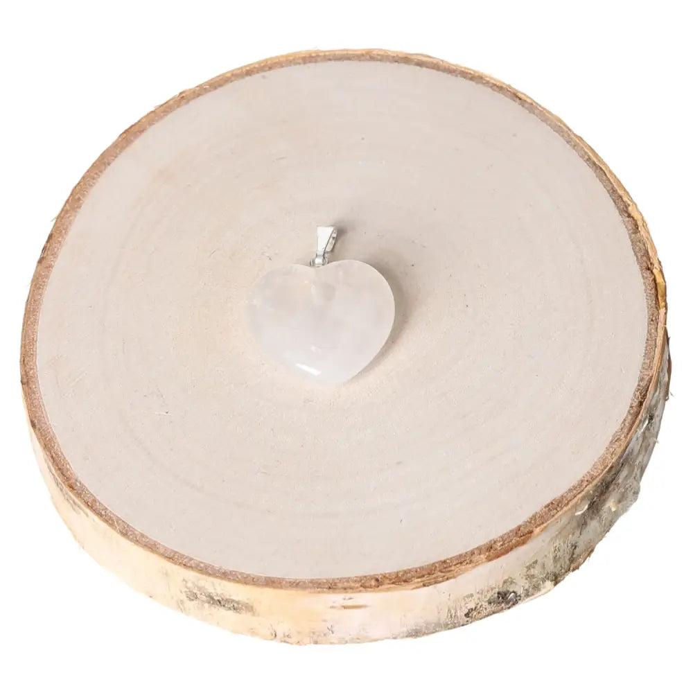 Rock Crystal Heart Pendant 20mm on wood display, symbolizing love and clarity, perfect for daily elegance.