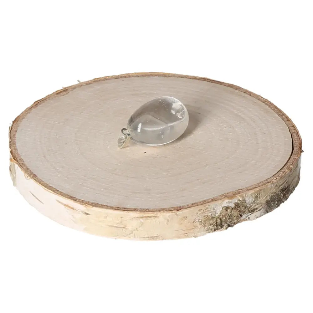 Elegant Rock Crystal Tumbled Pendant by Sylvia Crystals on wooden base, showcasing its clarity and premium craftsmanship.