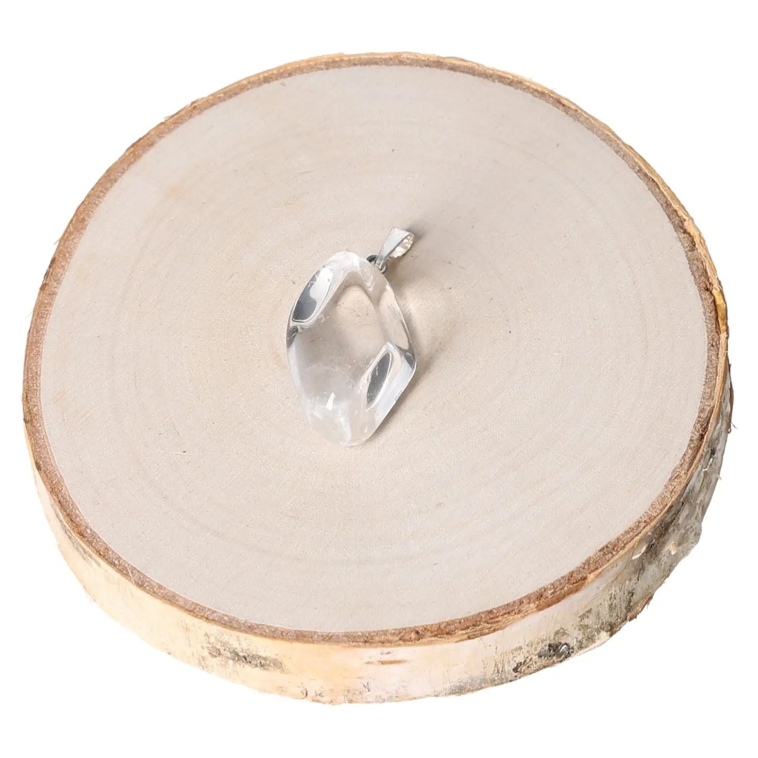 Elegant rock crystal tumbled pendant on wood background, showcasing its clear, genuine beauty and natural brilliance.