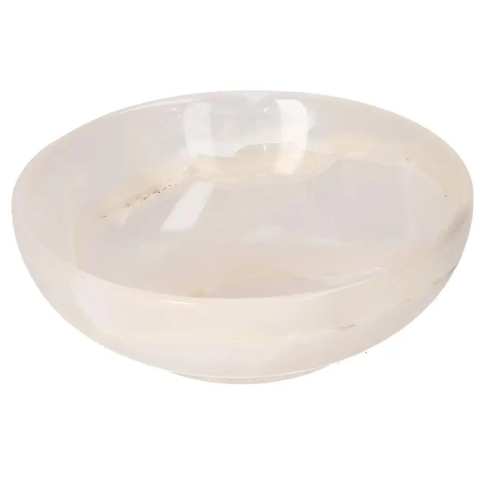 Rose Onyx Bowl with polished surface featuring unique veining, adding elegance and warmth to any interior décor space.