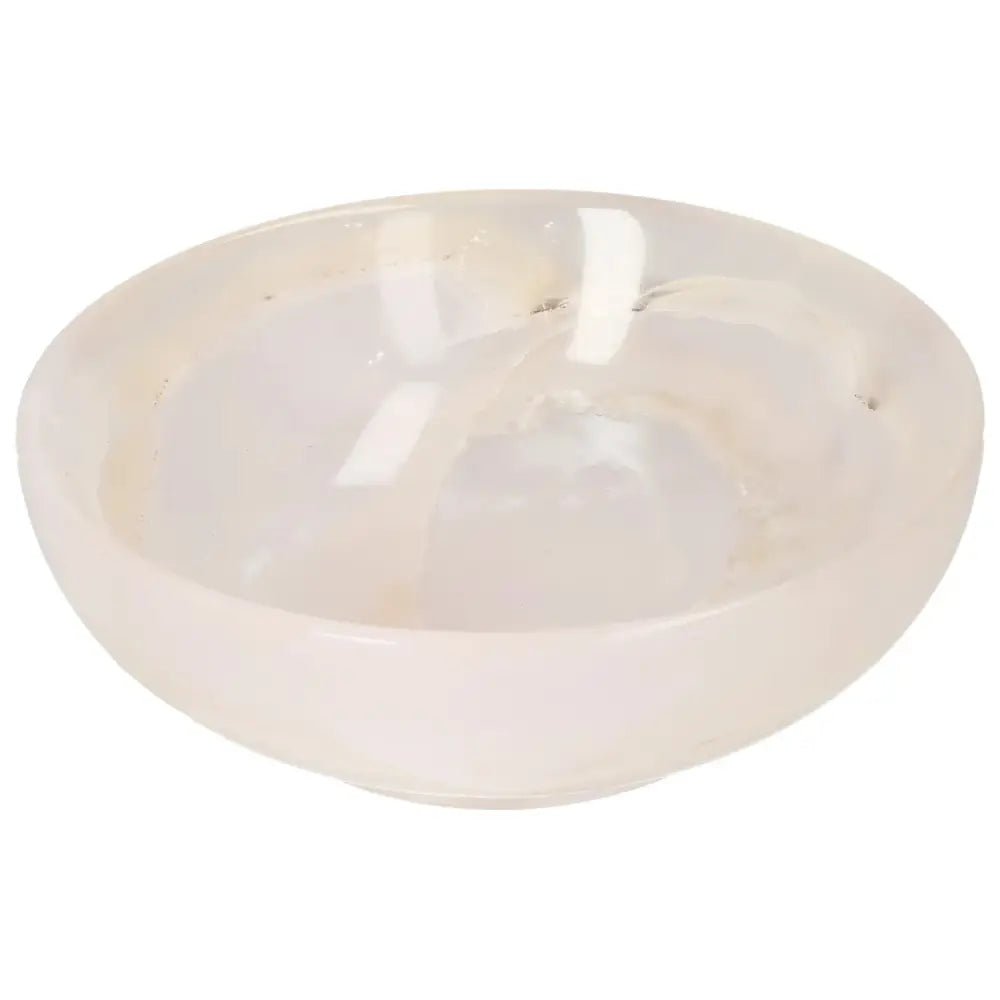 Rose Onyx Bowl showcasing smooth, polished onyx with delicate veining, capturing light beautifully; a unique, elegant décor piece.