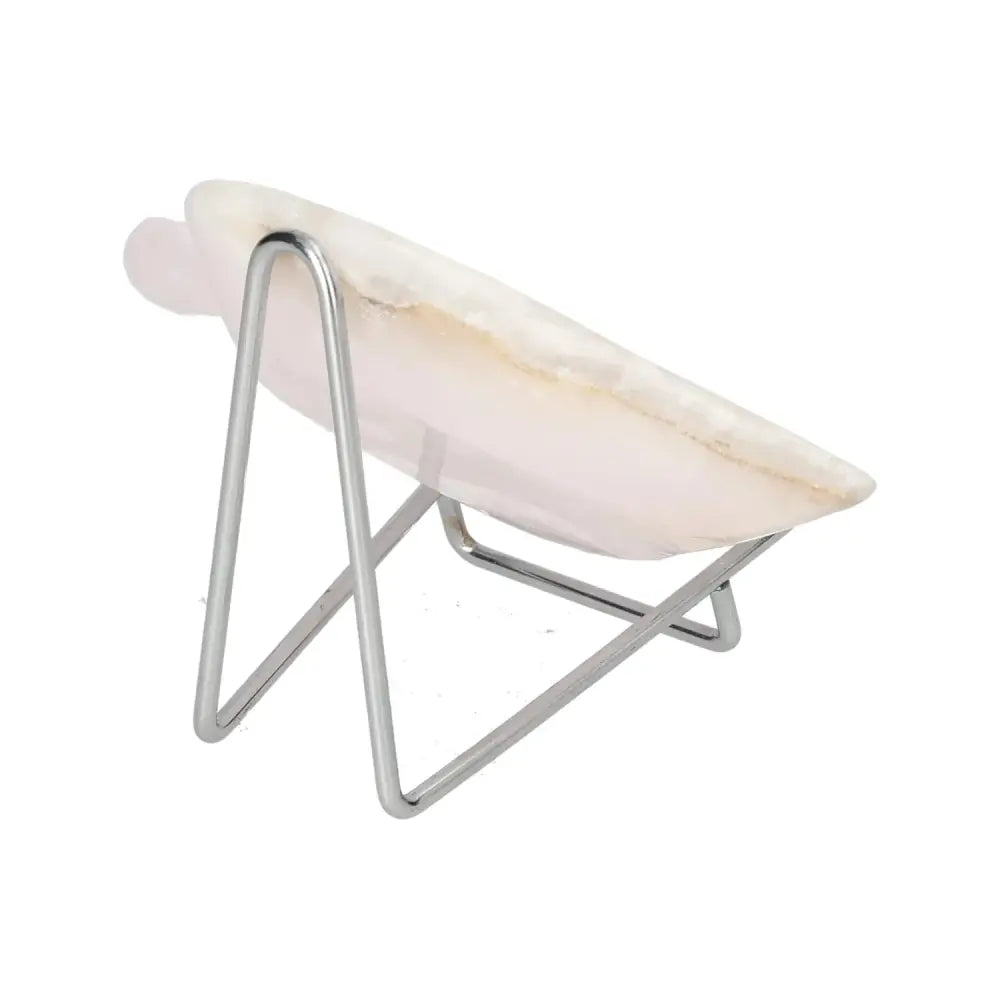 Side view of a rose onyx platter on a metal stand, showcasing its unique color variations and polished surface. Perfect for elegant displays.