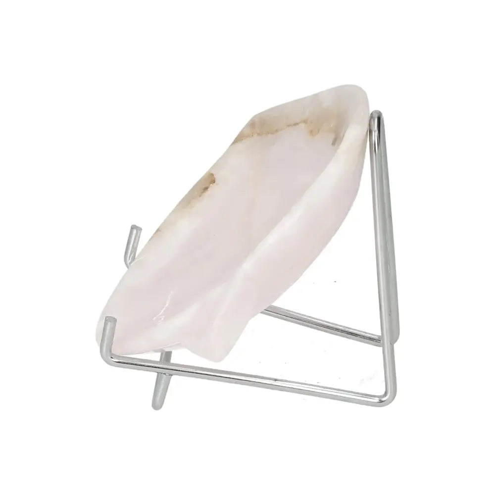 Rose onyx platter with natural color variations, displayed on a metal stand. A unique, polished tabletop centerpiece for elegant settings.