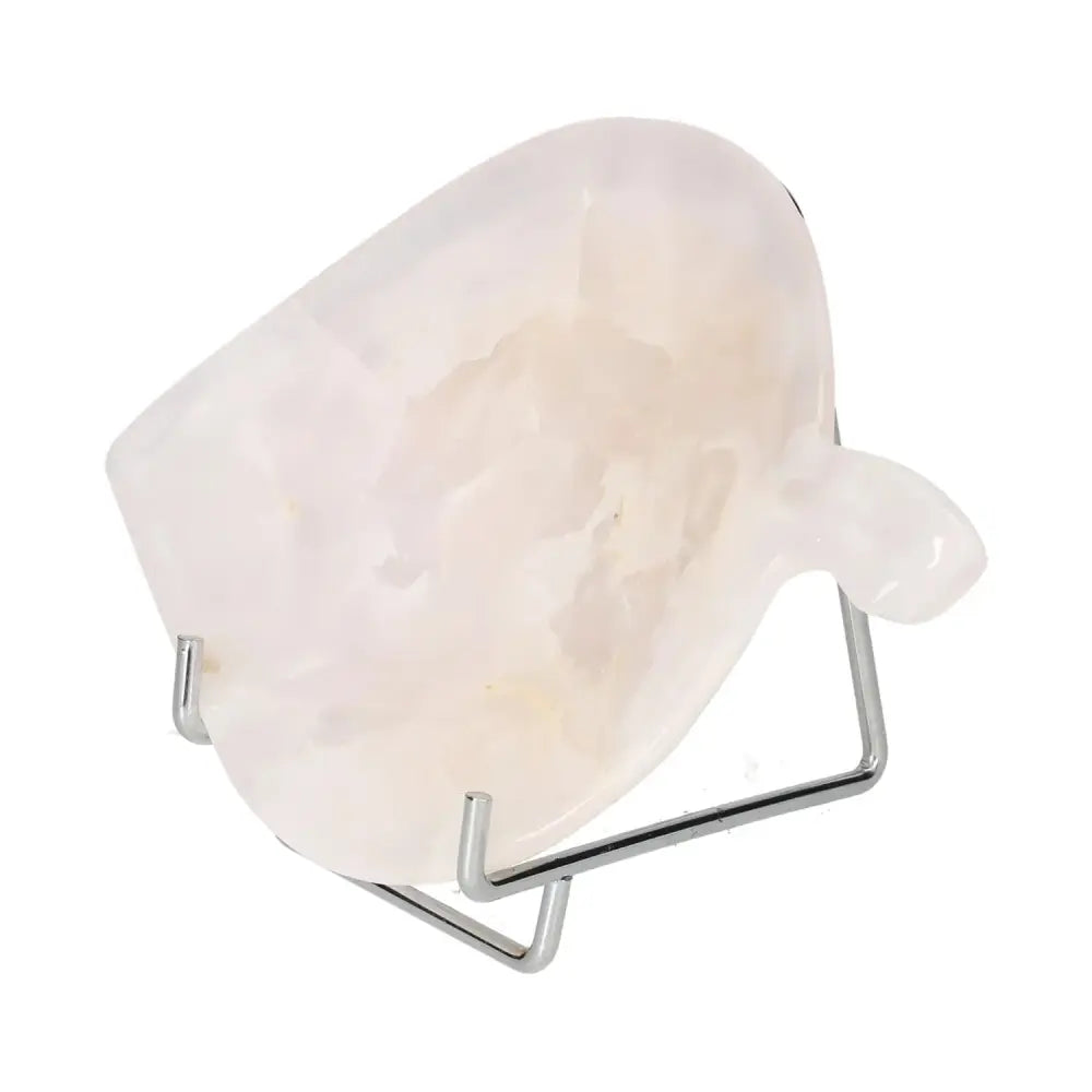 Rose Onyx Platter with unique veining on a stand, showcasing its polished elegance and natural beauty in warm tones.