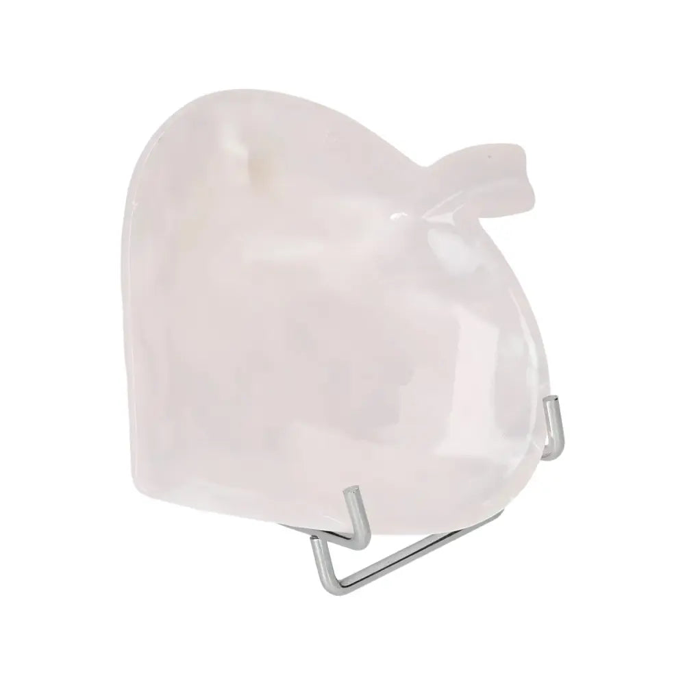 Rose onyx apple-shaped platter on stand, showcasing unique veining and polished surface. Ideal for enhancing elegant tablescapes.