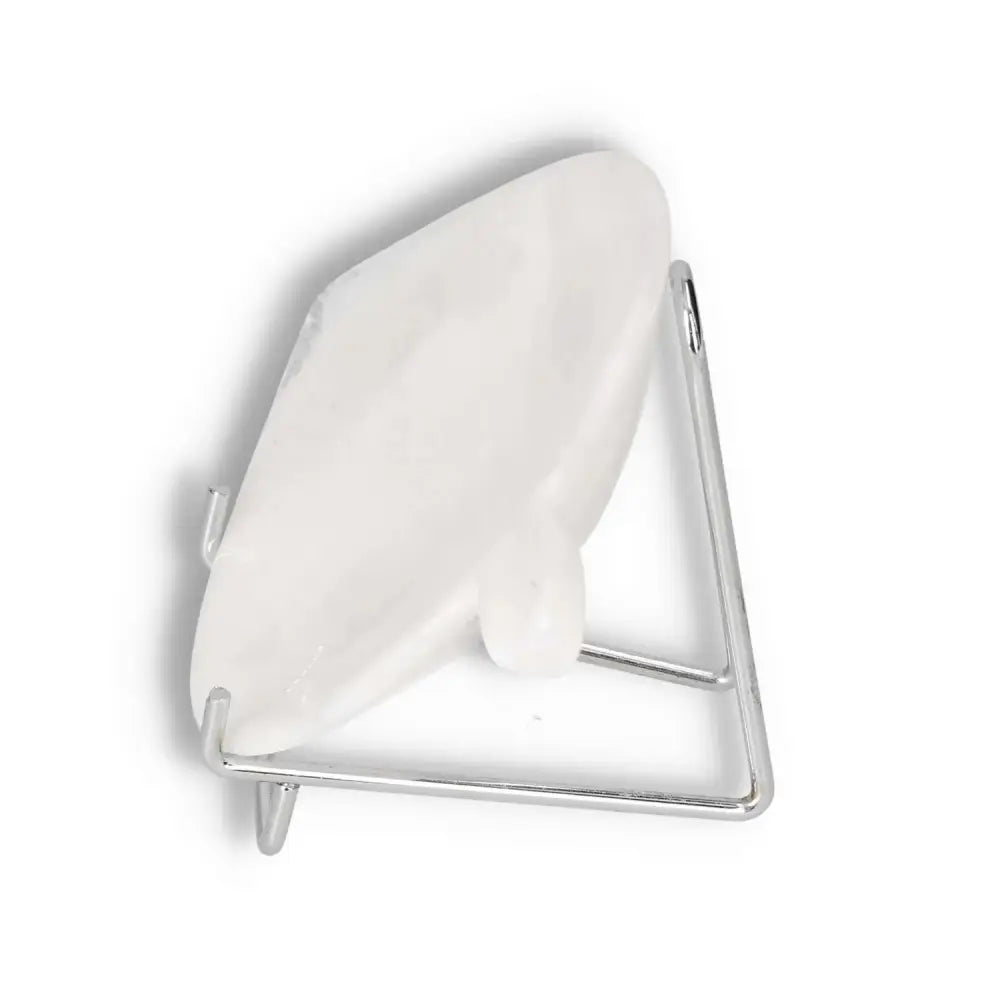 White decorative plate displayed on a sleek metal stand
