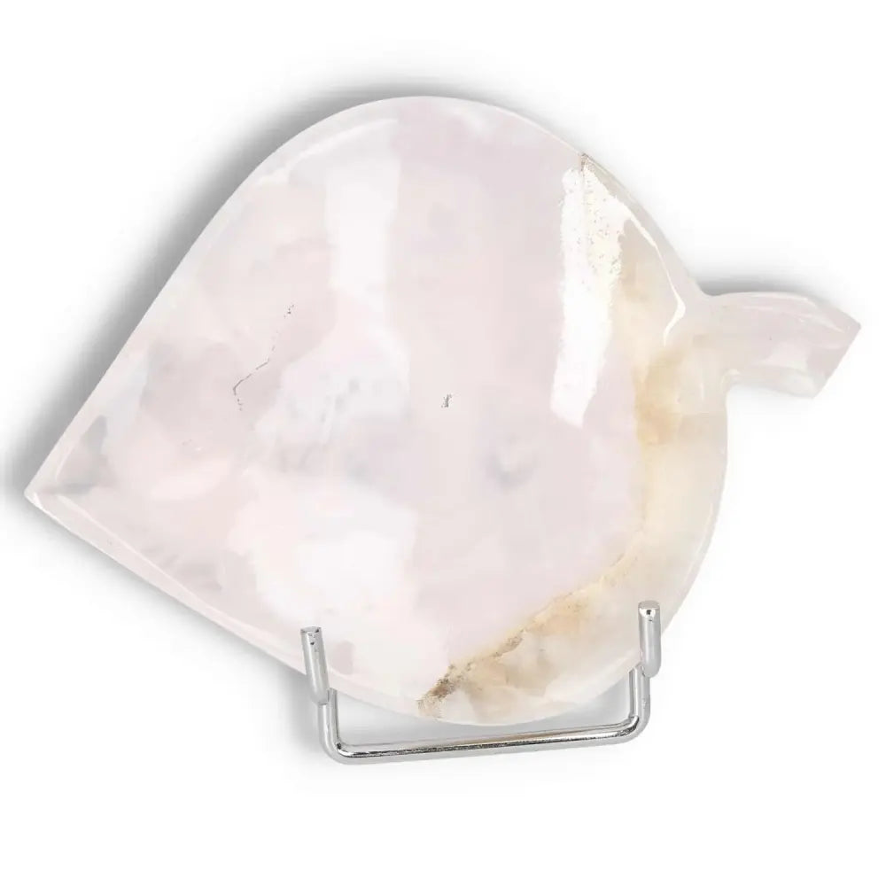 Rose Onyx Platter with unique veining on display stand, showcasing smooth polished surface and warm hues.