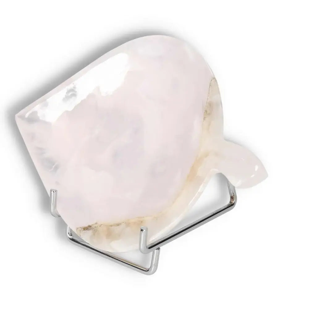 Rose Onyx Platter showcasing unique color variations and polished surface on a stand.