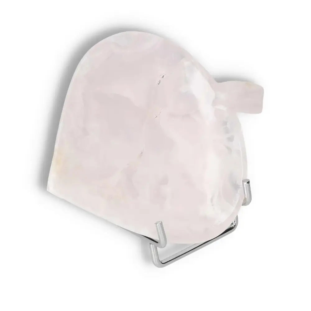 Rose onyx platter with soft pink hue on display stand, showcasing unique veining and polished surface, ideal for elegant decor.