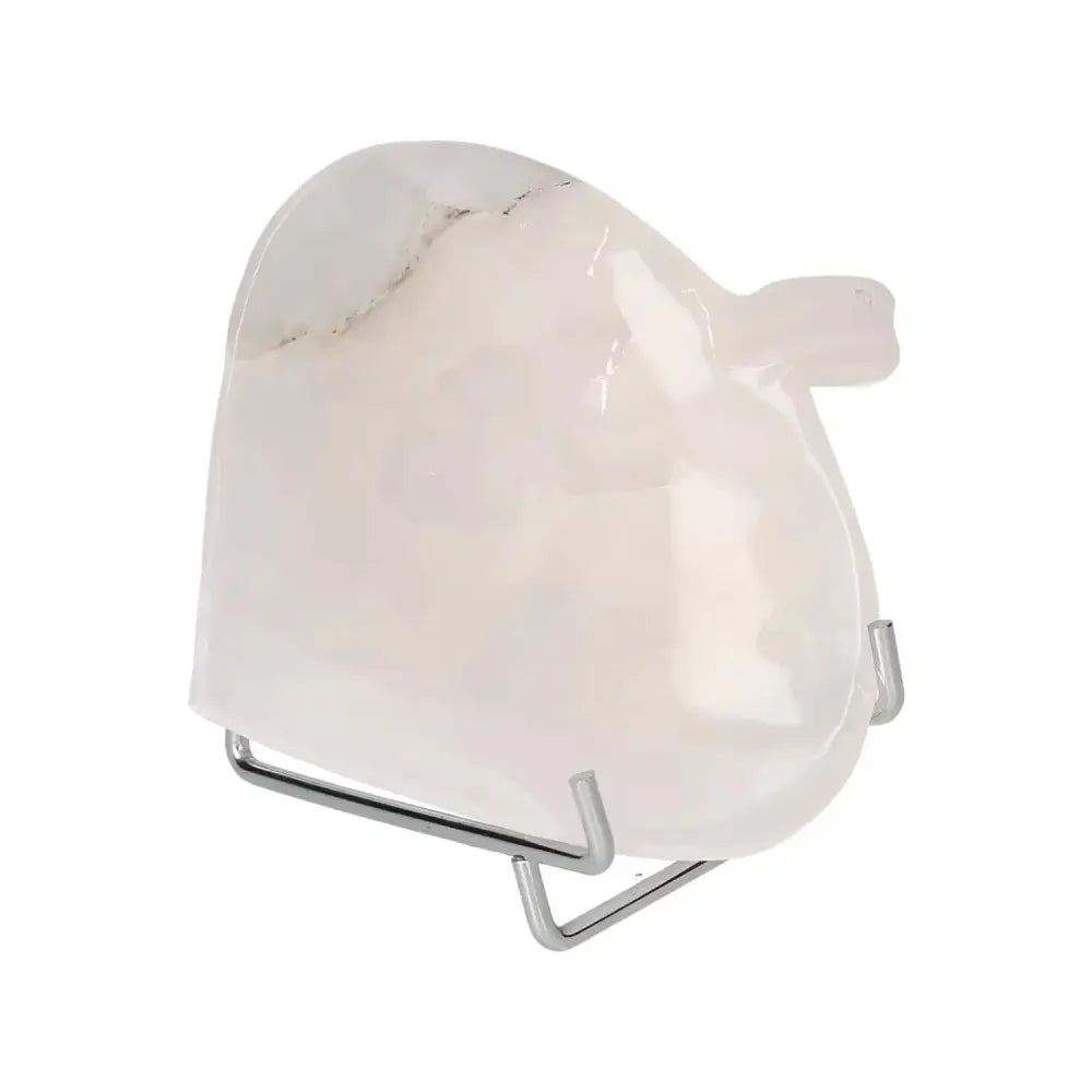 Rose onyx platter with unique color variations, displayed elegantly on a stand, highlighting its natural beauty and polished surface.