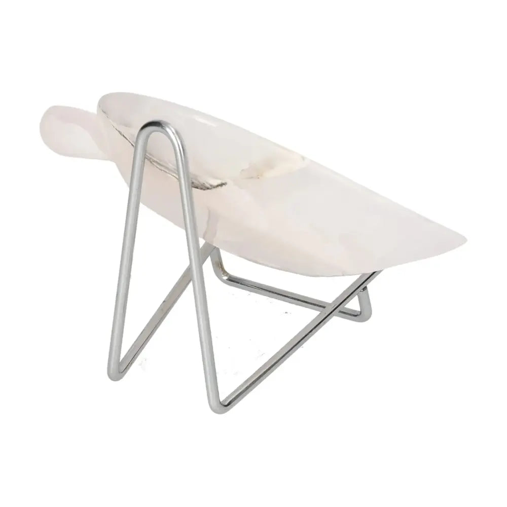 Rose onyx platter on a modern metal stand, showcasing its elegant design and unique veining.