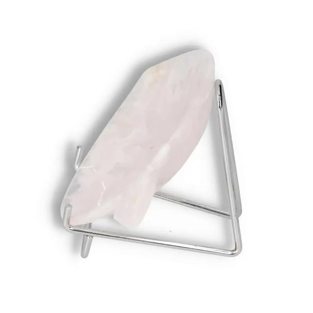 Side view of a rose onyx platter on a metal stand, showcasing its polished surface and unique veining.