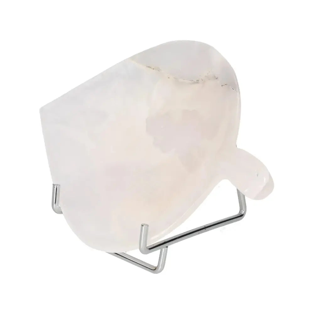 Rose Onyx Platter with unique veining on a stand, reflecting elegance and natural beauty.