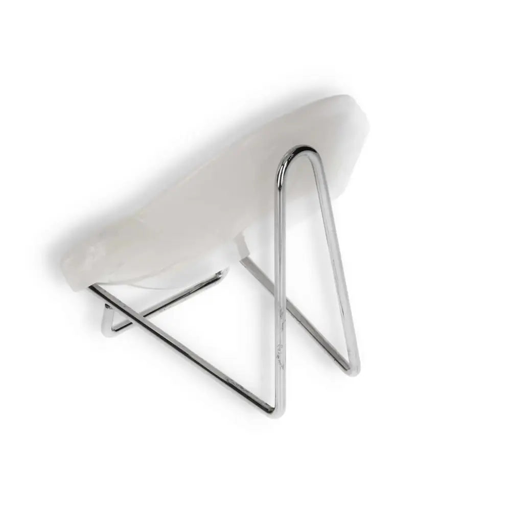 Back view of a rose onyx platter on a minimalist metal stand, showcasing the smooth polished surface and unique design.