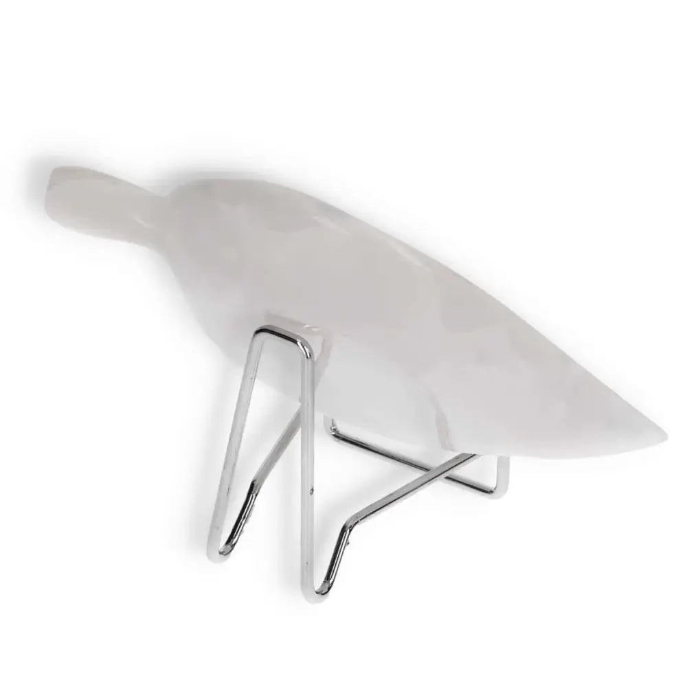 White modern decorative sculpture of a bird on a chrome stand, showcasing minimalist design and elegance.