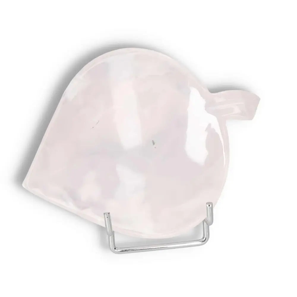 Rose onyx platter with unique veining, reflecting light on a smooth, polished surface, elevating any tablescape.