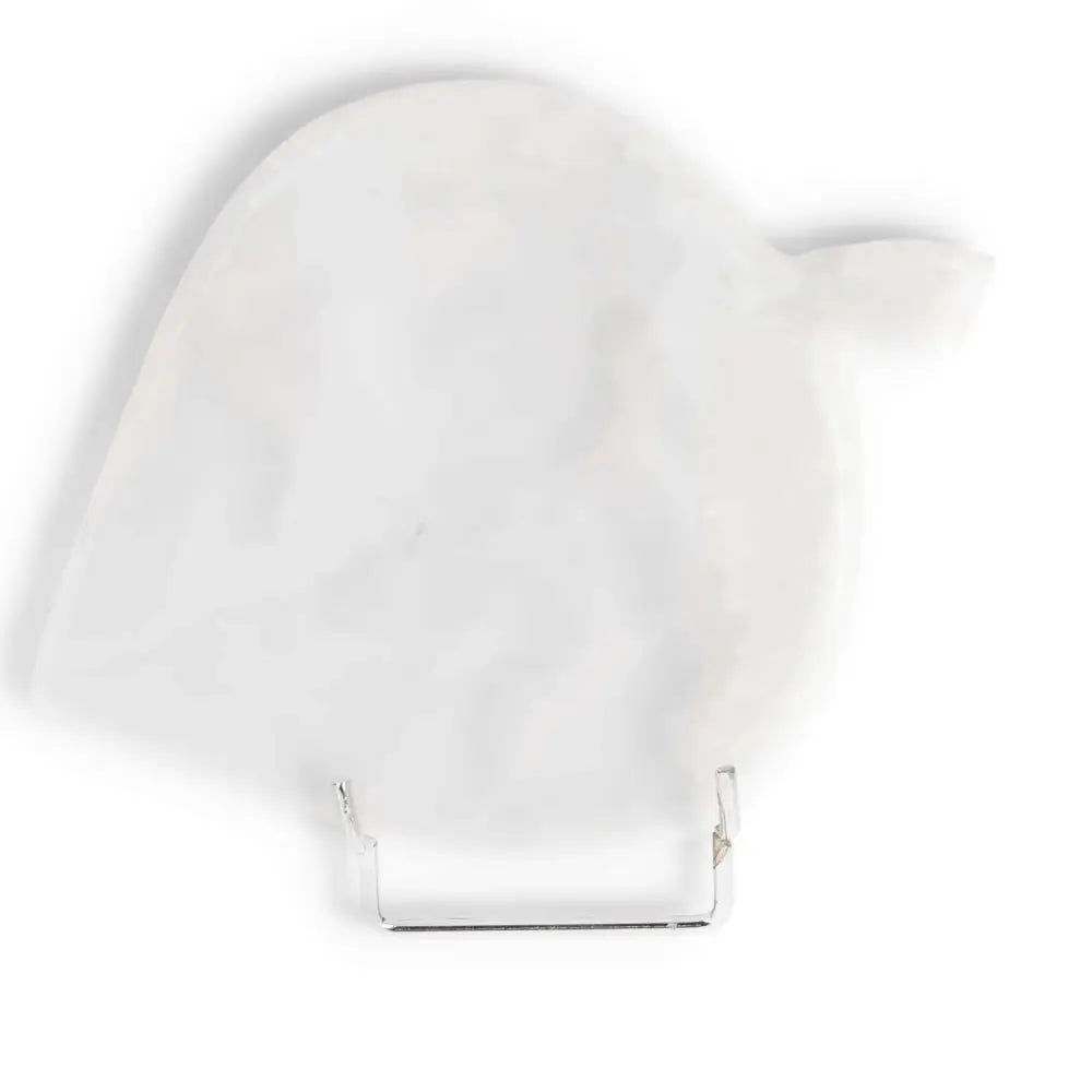 Elegant white onyx platter with unique shape, displayed on a stand, showcasing polished surface and natural color variations.