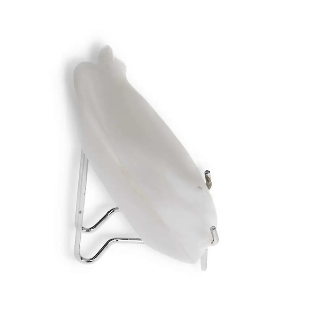 Side view of a white decorative plate on a metal stand against a plain background.