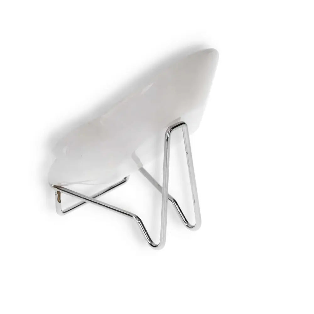 Side view of a modern, minimalist white onyx platter on a sleek metal stand, showcasing its contemporary design and polished surface.