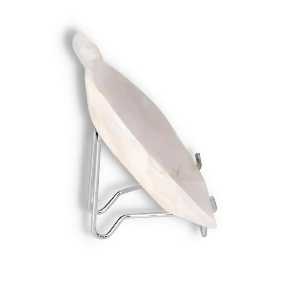 Side view of a rose onyx platter on a silver stand, showcasing its smooth surface and delicate rose hue.