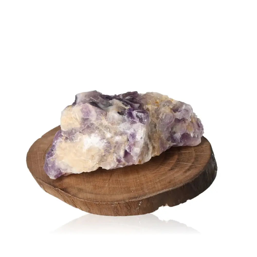 Rough Amethyst gemstone on wooden base showcasing natural elegance and calming properties, ideal for aesthetic appeal and emotional balance.