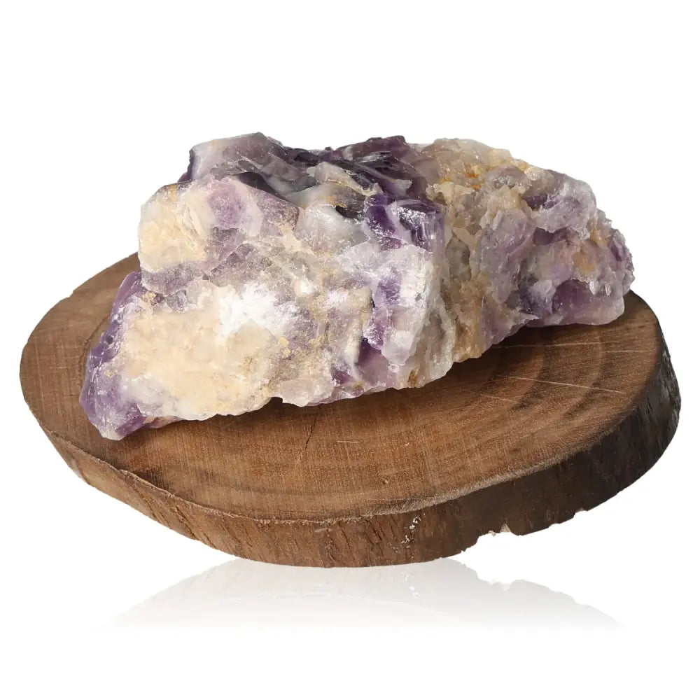 Rough Amethyst gemstone on a wooden base displaying natural elegance and calming purple hues ideal for collectors seeking tranquility.